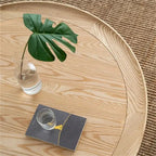 Table basse ronde en bois à deux niveaux avec base en rotin